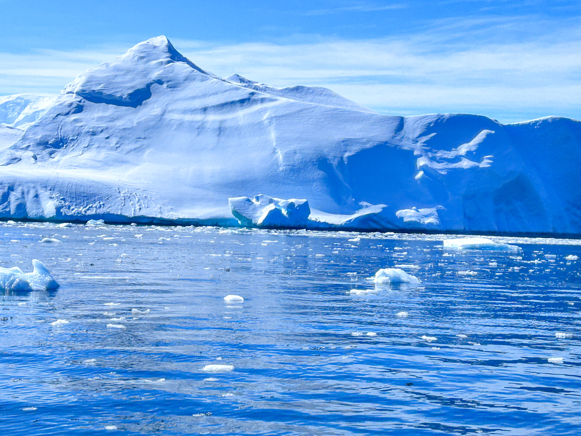 Breathtaking view of Antarctica's pristine snow-covered landscape with towering icebergs.