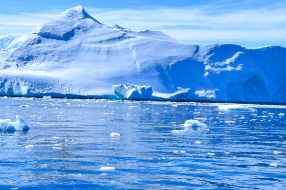 Breathtaking view of Antarctica's pristine snow-covered landscape with towering icebergs.